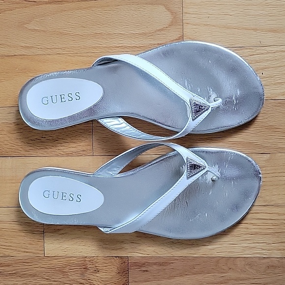 White flip flop sandal by Guess, size 9 w/ silver guess emblem. - Picture 2 of 3